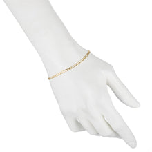 Load image into Gallery viewer, Fine yellow gold Figaro bracelet on a womens hand
