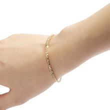 Load image into Gallery viewer, Fine yellow gold rope bracelet on a womens hand
